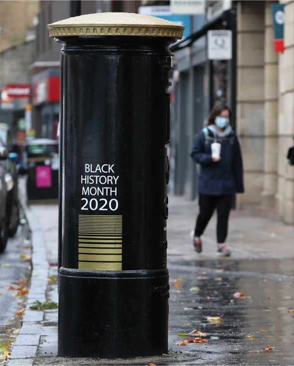 A can of soda on a city street

Description automatically generated